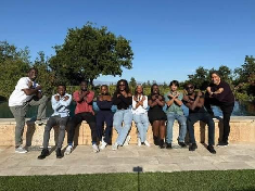 The cohort together on campus