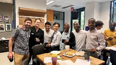 Fellows and hosts sharing a meal